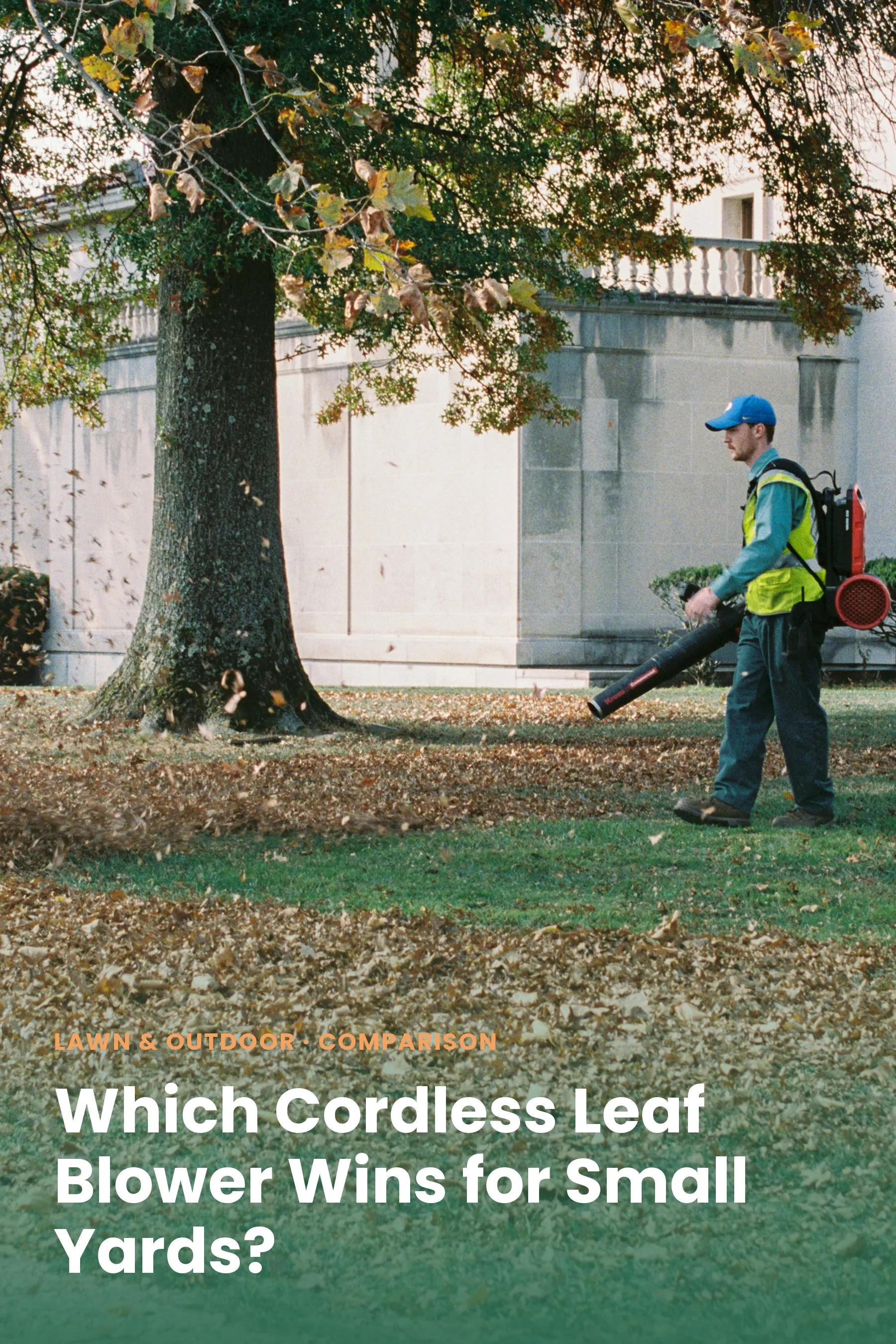 Man using a backpack leaf blower to clear autumn leaves from a lawn