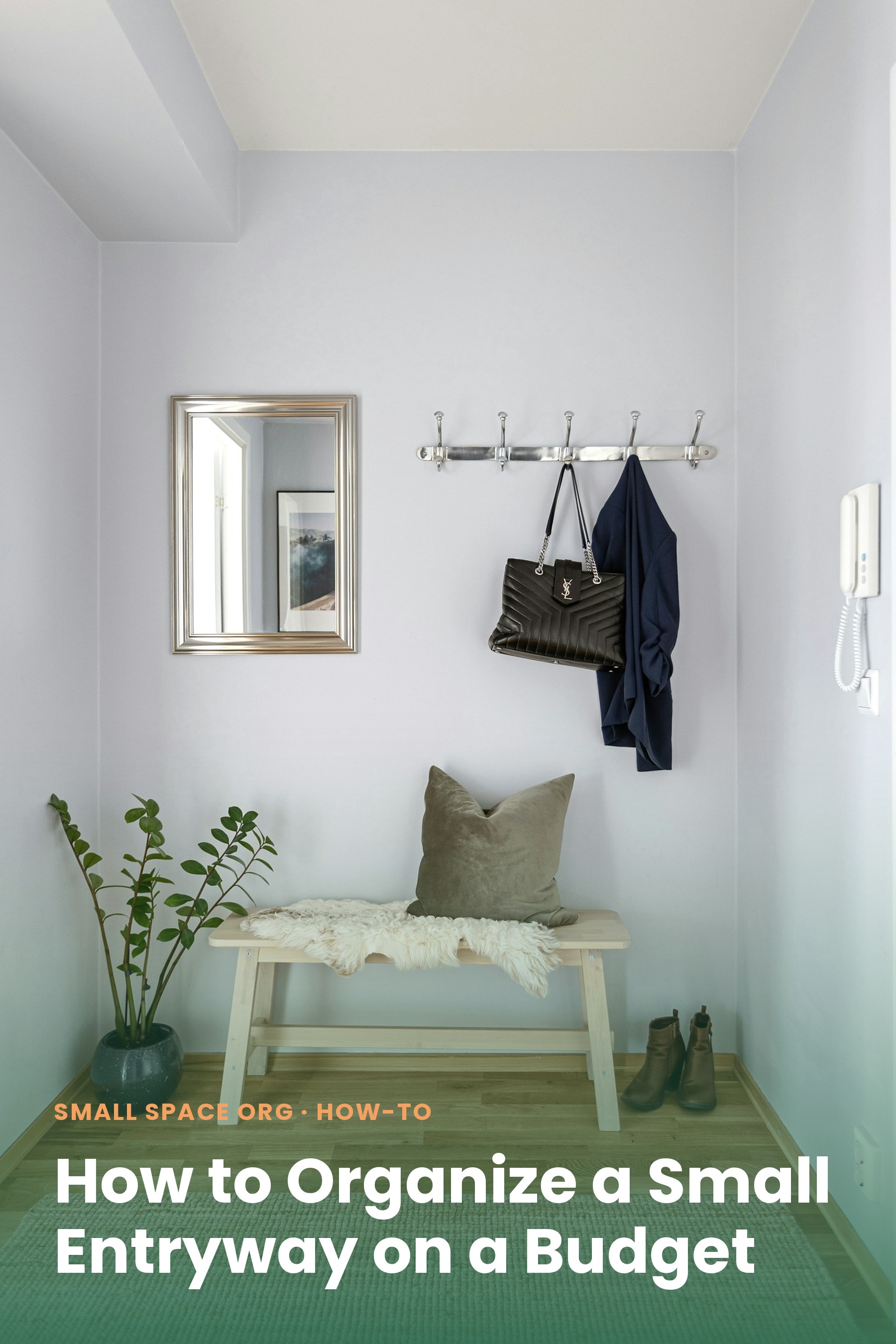 Small organized entryway nook with wall hooks holding a coat and bag, a mirror, and a bench with boots underneath
