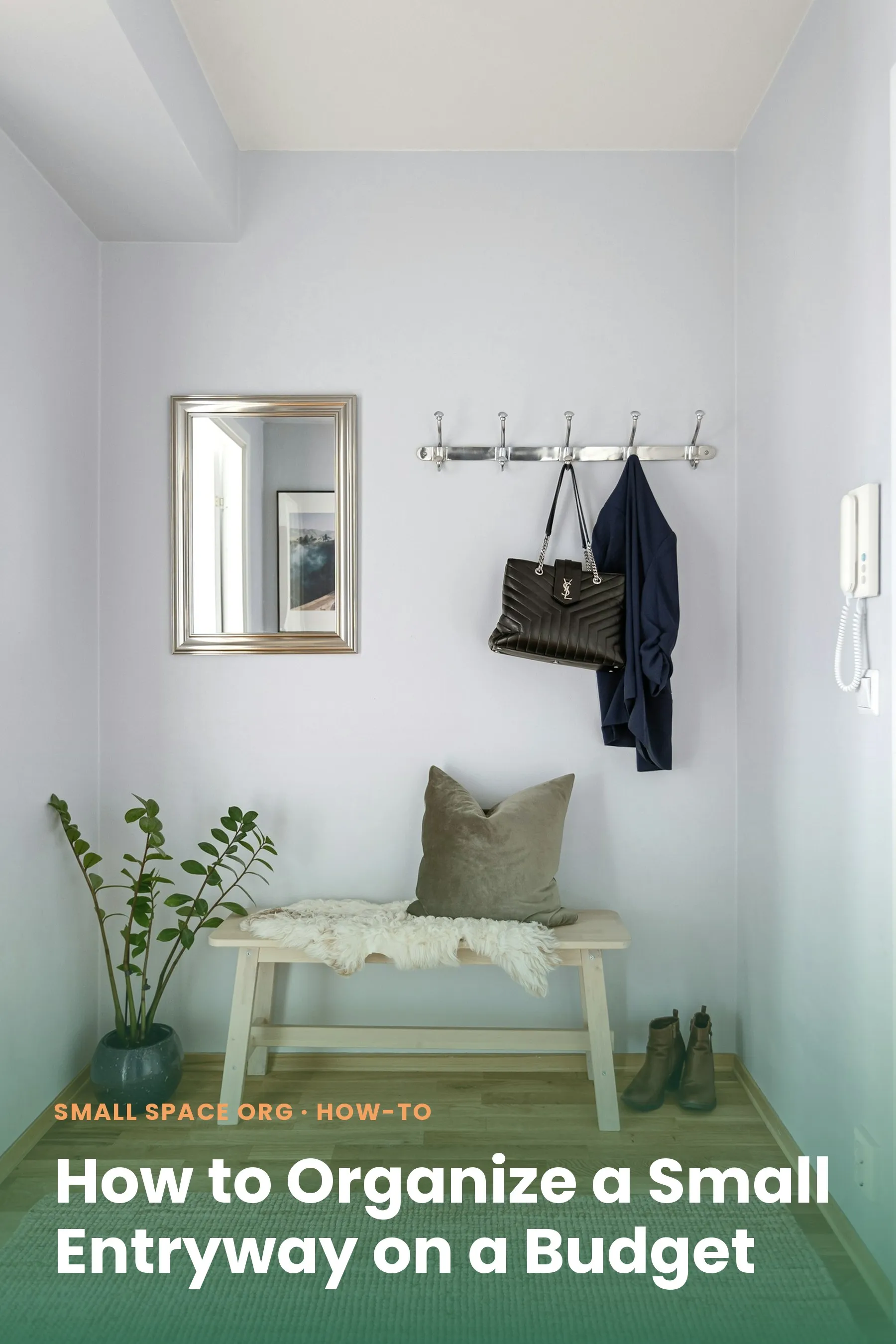 Small organized entryway nook with wall hooks holding a coat and bag, a mirror, and a bench with boots underneath
