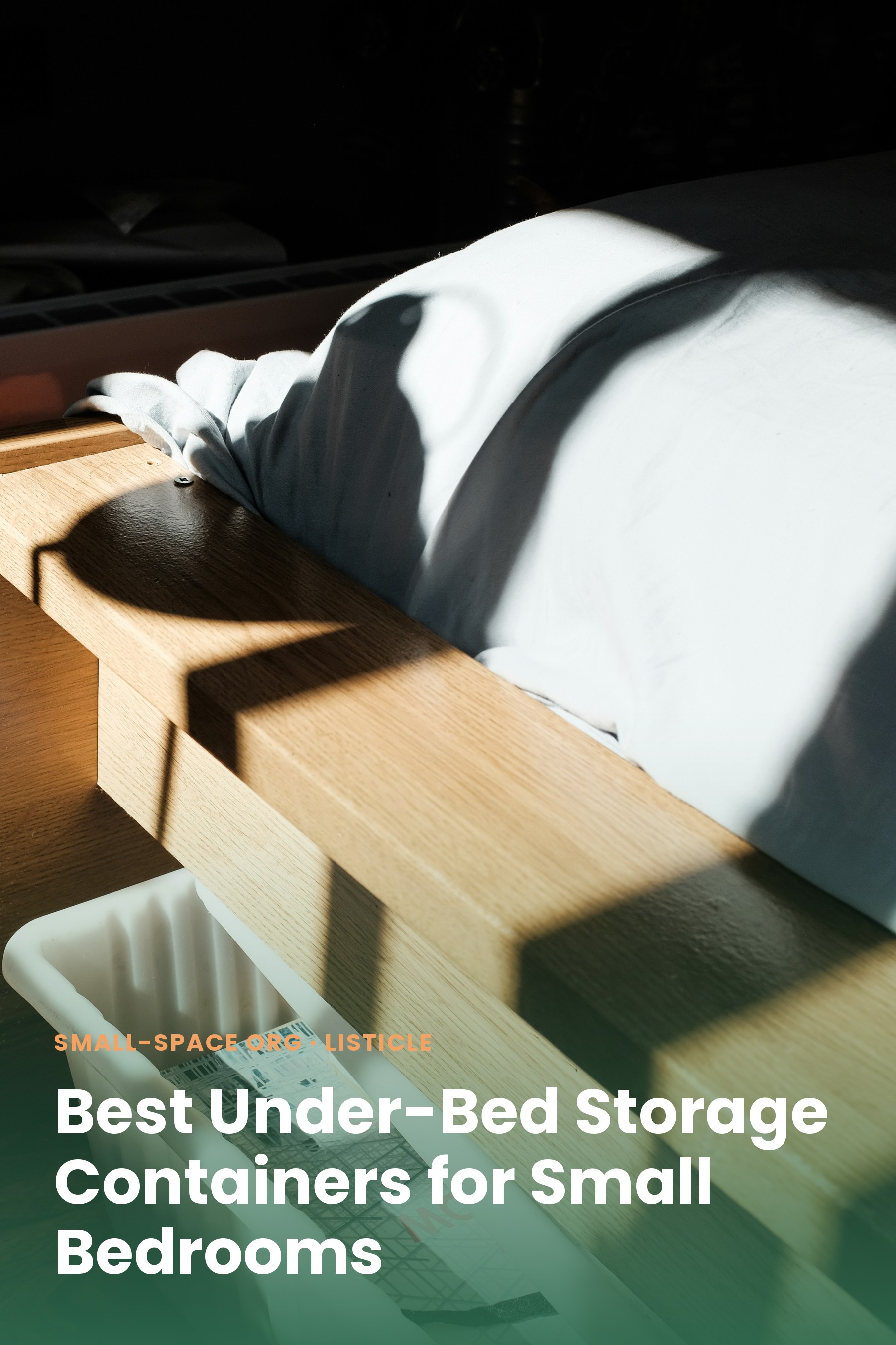 A white storage bin tucked under a wooden bed frame in dramatic morning light
