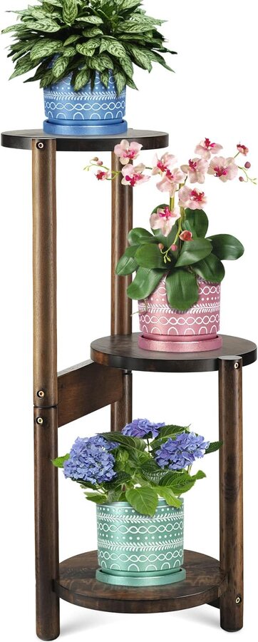 Tall three-tier dark wood plant stand in a mid-century style with round shelf platforms at staggered heights
