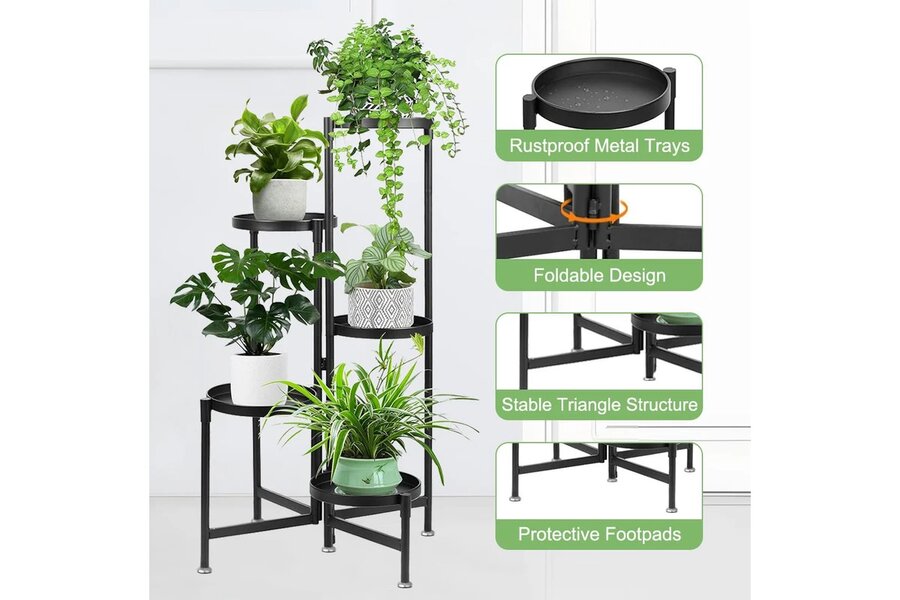 Black folding five-tier metal plant stand arranged in a corner, with potted plants at staggered heights