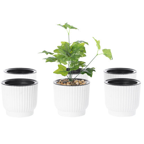 White ribbed T4U self-watering pots with a small houseplant, black water-level indicator visible