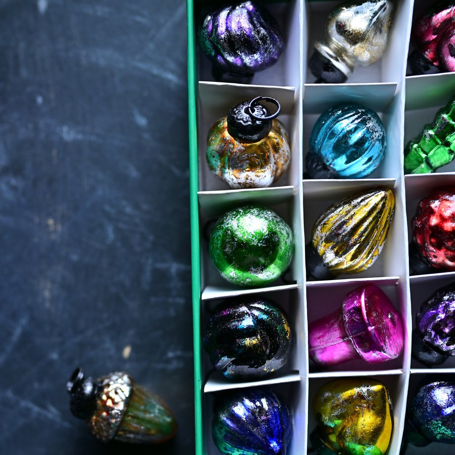 A divided tray of colorful glass ornaments in a compartment box, a stock photo that stands in for an ornament storage box